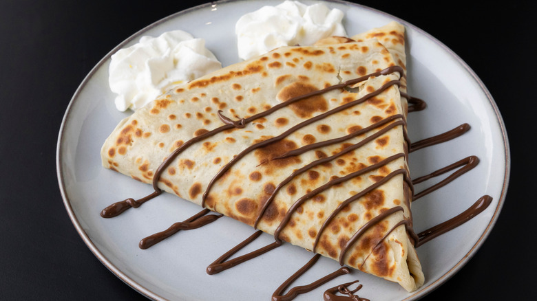 crêpe with chocolate sauce and whipped cream