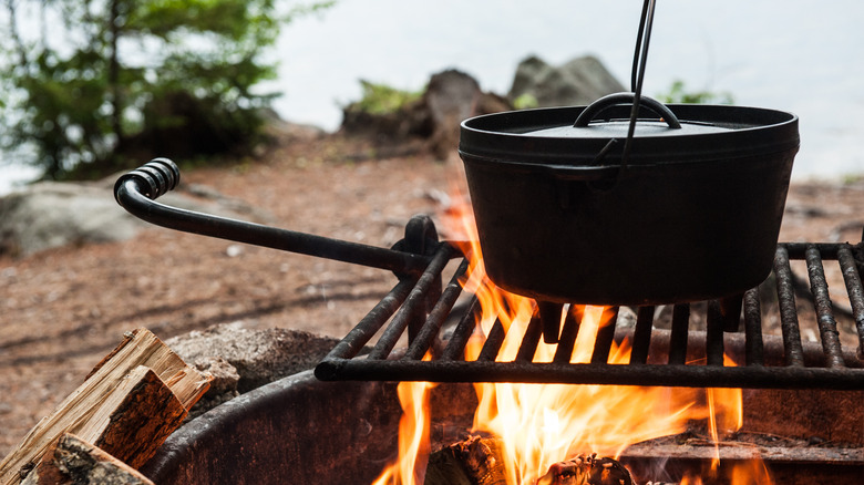 Cast iron dutch oven on a campfire