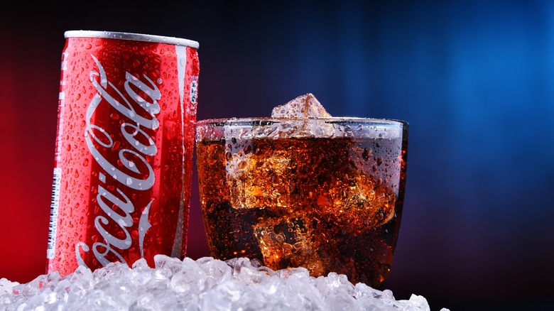Glass and can of Coca-Cola