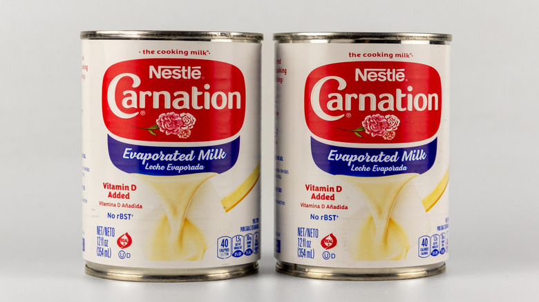 Two cans of Carnation Evaporated Milk