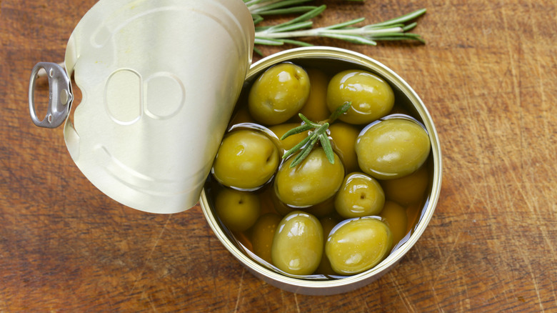 Open can of green olives