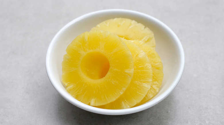 Canned pineapple in white bowl