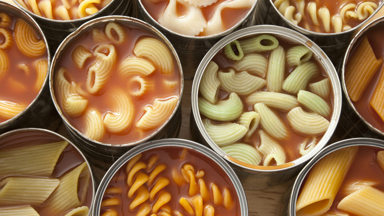 Various cans of pasta in tomato sauce