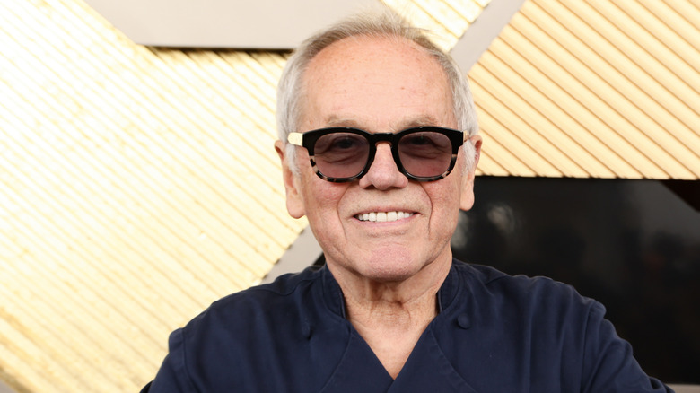 Wolfgang Puck wearing sunglasses and smiling
