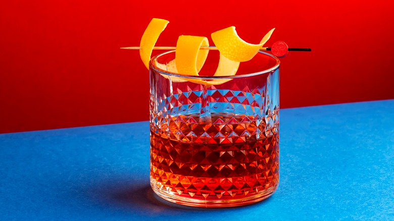 Sazerac cocktail on blue bar