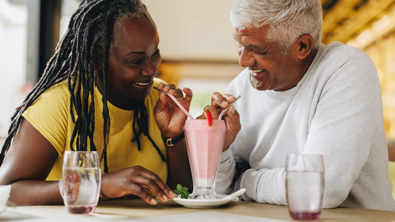 Couple enjoying strawberry ice cream
