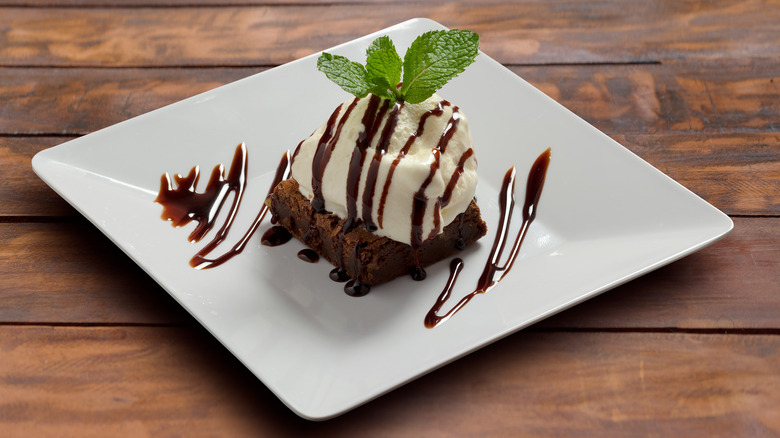 Plated brownie and ice cream
