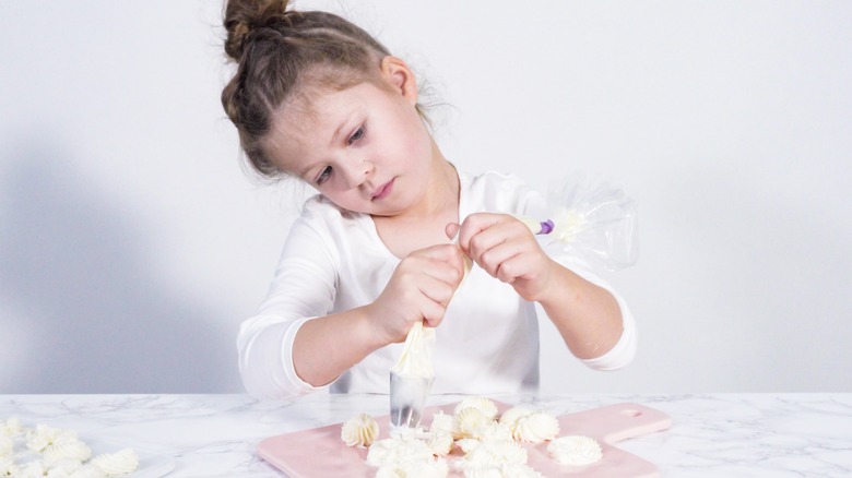Child practicing piping skills