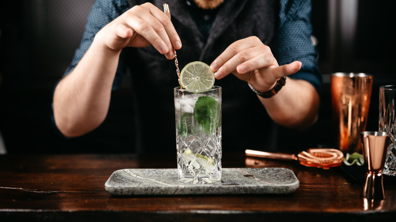 bartender making mojito