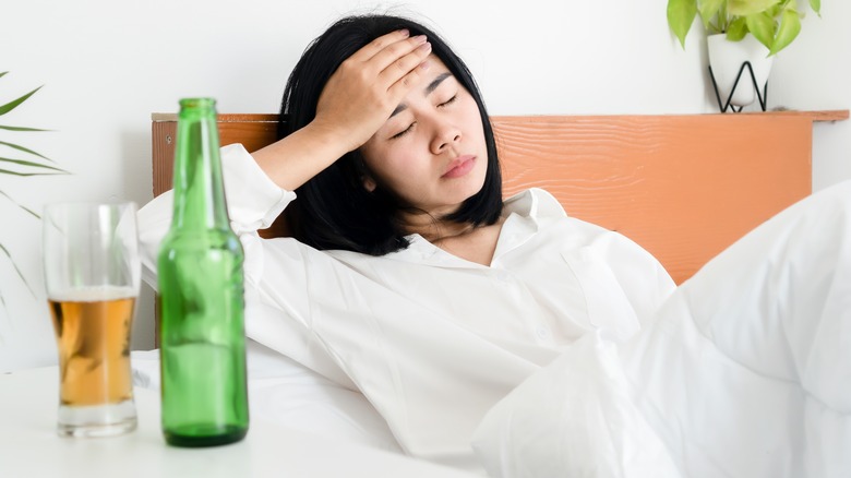 Woman holding her head in pain