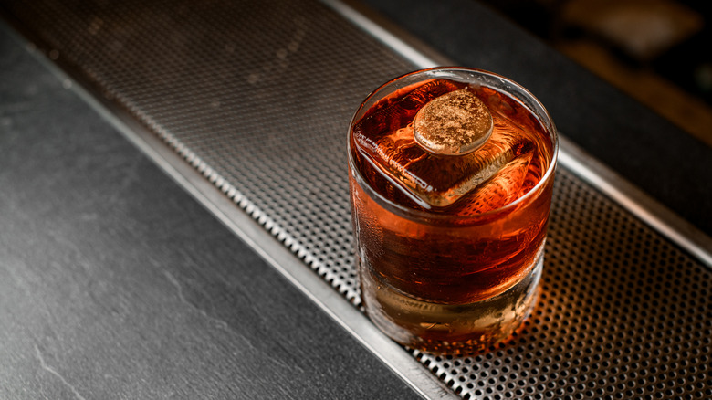 A whiskey cocktail with ice