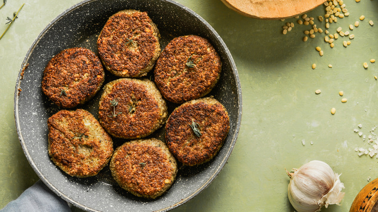 Fritters in a skillet on a table