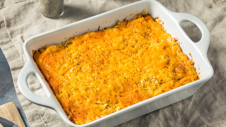 Cheesy casserole in a white baking dish