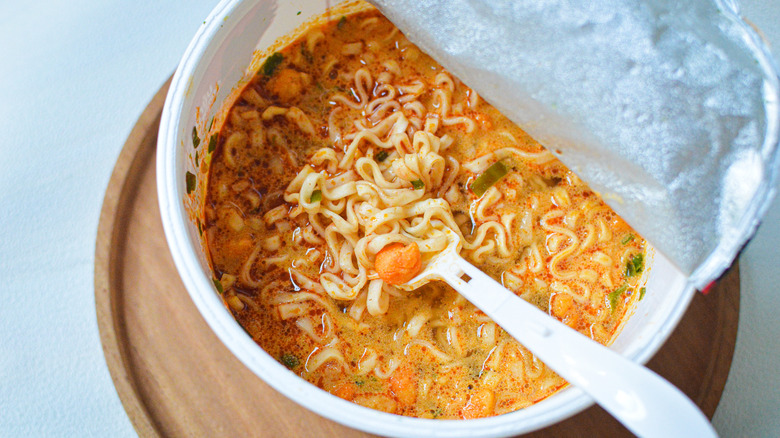 instant cup of ramen with fork