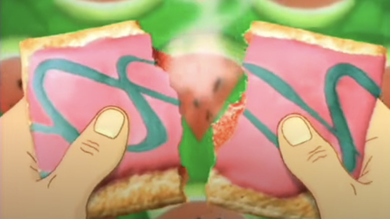 Still from a commercial with animated hands breaking open a Pop-Tart to show its filling