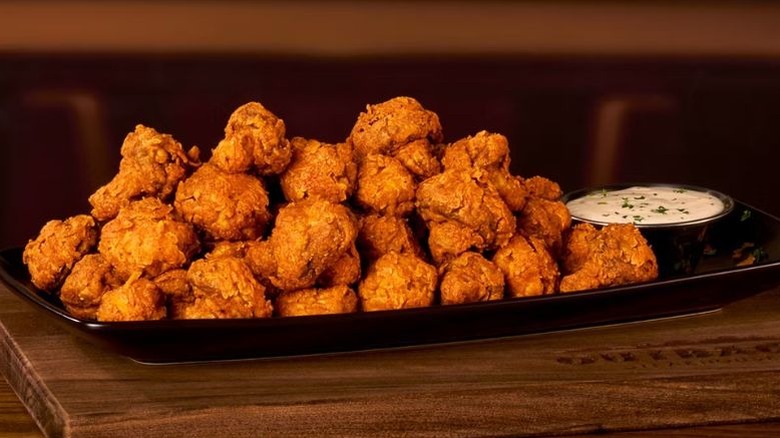 A plate of Outback Steakhouse's Sydney Shrooms on a platter