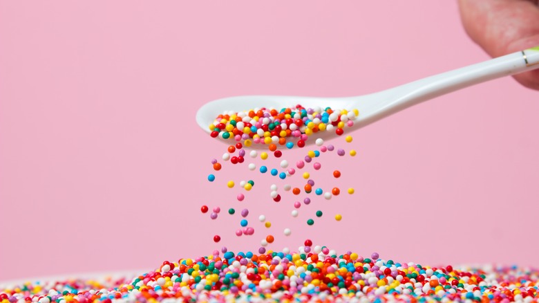 Spoonful of colorful dessert sprinkles