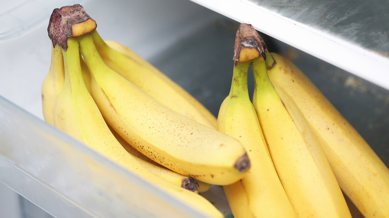 Bunches of bananas in a refrigerator