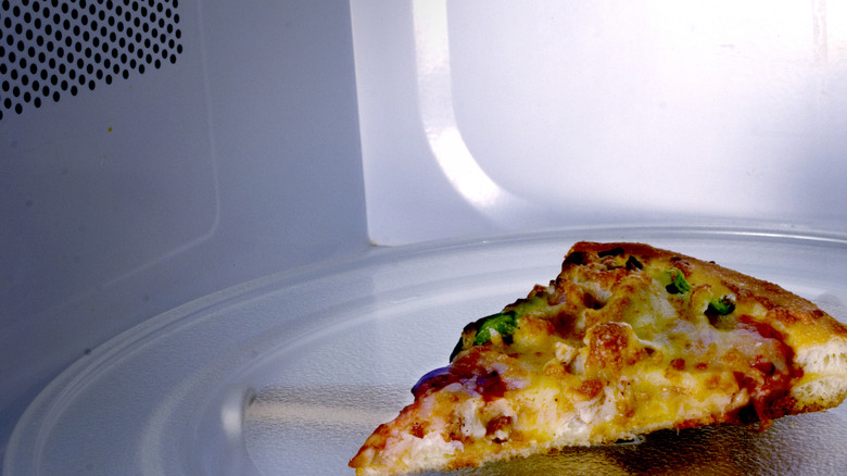 Piece of pizza in a microwave