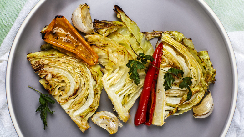 Grilled cabbage steak with peppers
