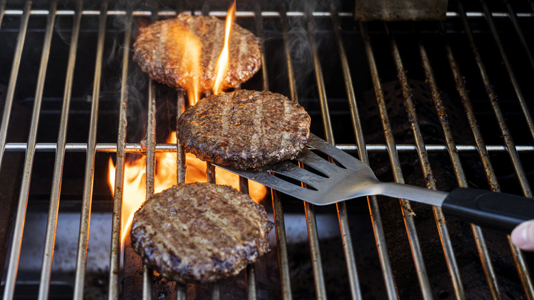 Flipping burgers on the grill