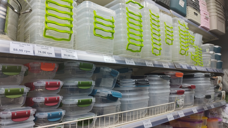 A selection of stackable plastic containers in a grocery store