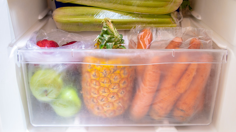 Fruits and vegetables packed into a crisper drawer