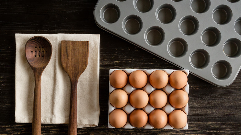 eggs next to muffin pan