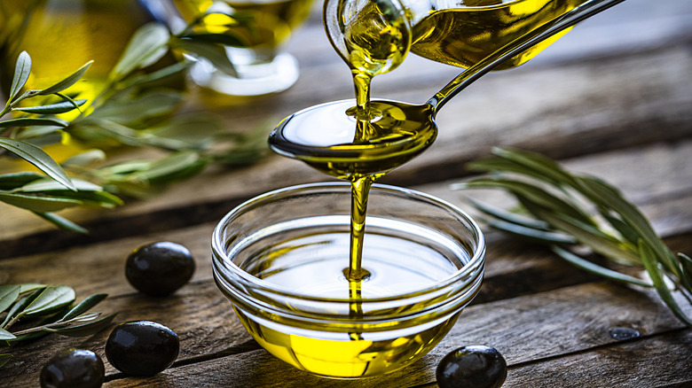 pouring extra virgin olive oil