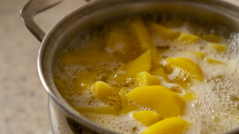 Pot of potatoes boiling in water