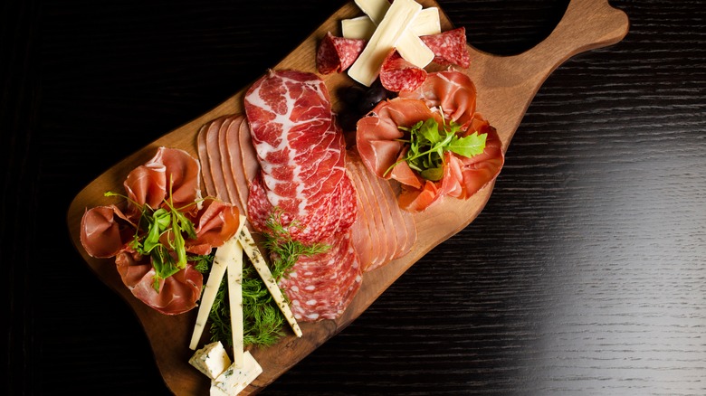 charcuterie board with herbs