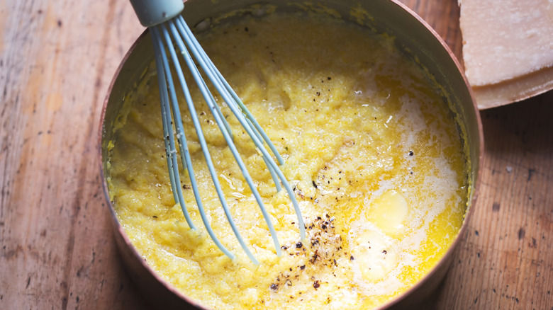 pot of polenta and whisk