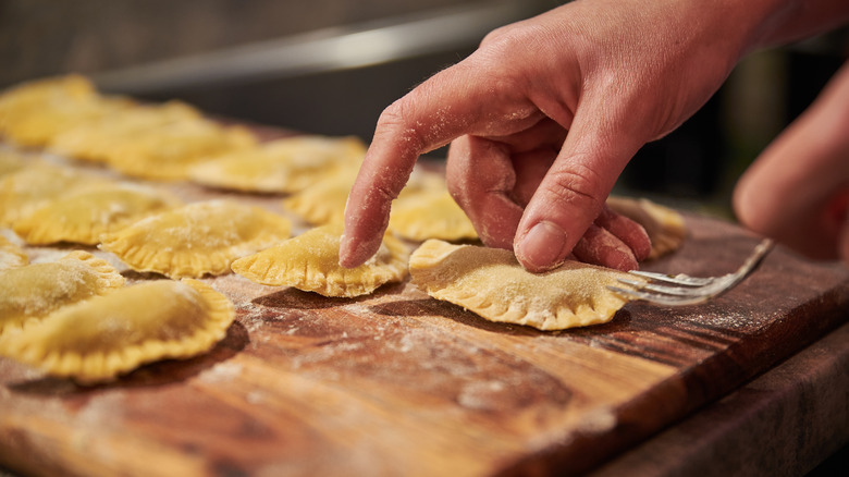 cook making fresh ravioli