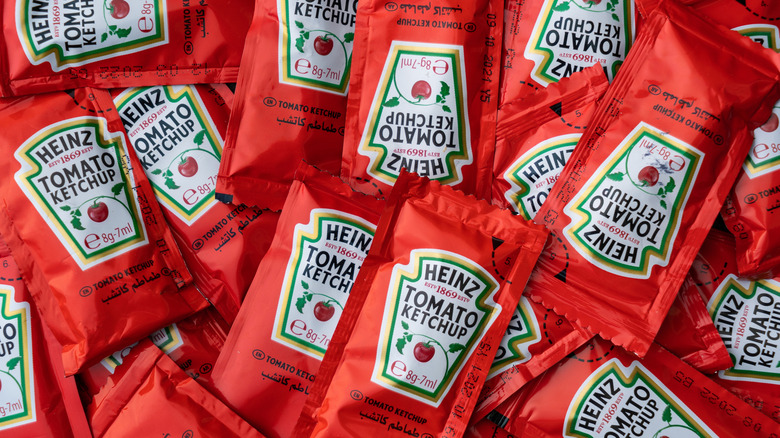 Ketchup condiment packets in a pile