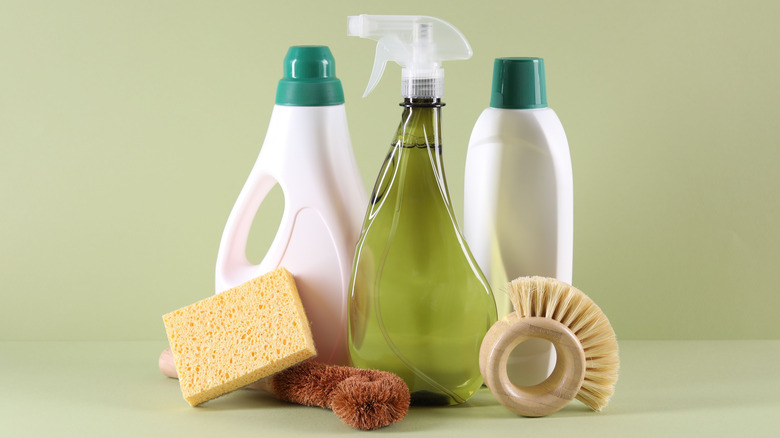 Cleaning products and supplies on a neutral background