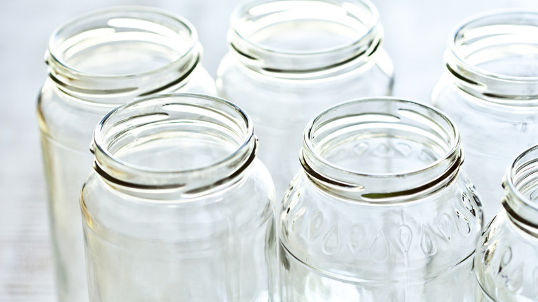 Close-up view of old glass jars in a grouping