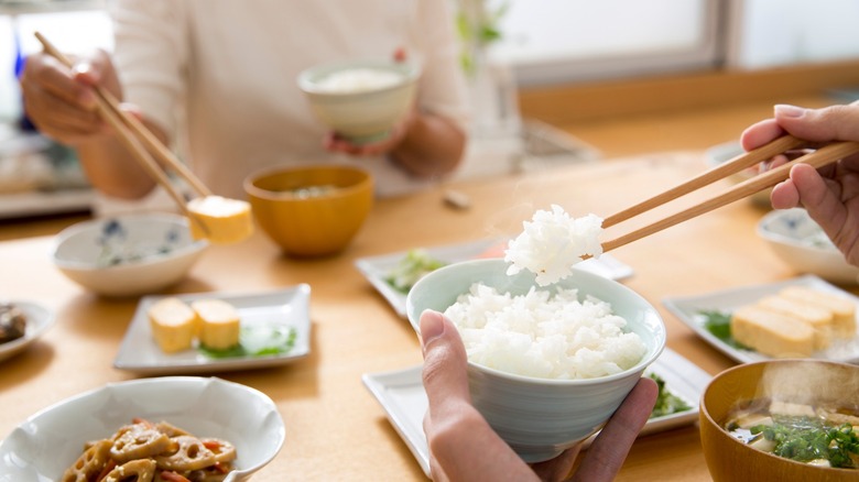 Two people eating dinner at table
