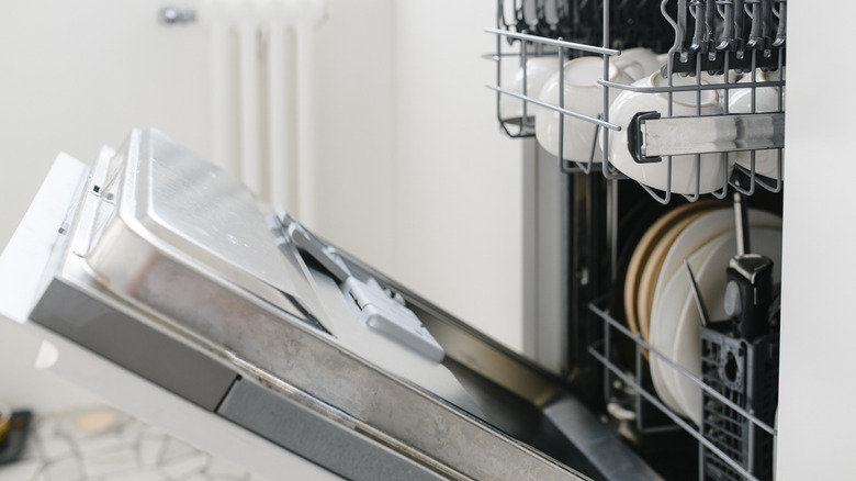 open dishwasher with dishes