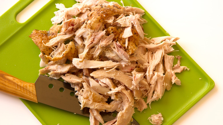 Chopped chicken on cutting board