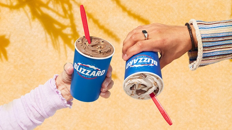 Hands holding Dairy Queen Blizzards