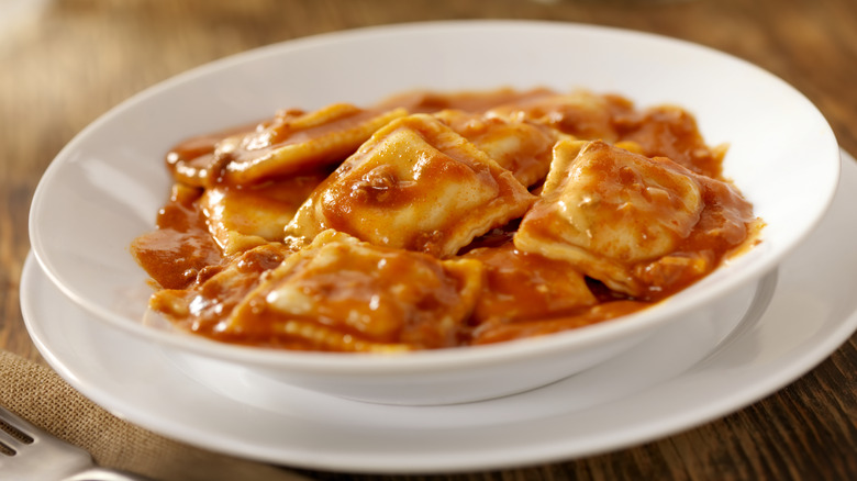 Bowl of ravioli in a tomato meat sauce
