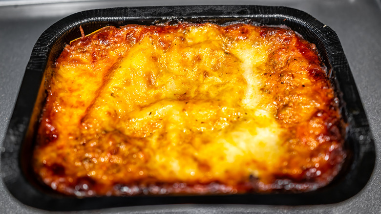 Frozen lasagna in plastic container