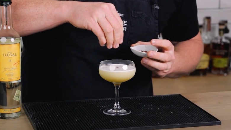 A bartender makes a Ready Fire Aim cocktail