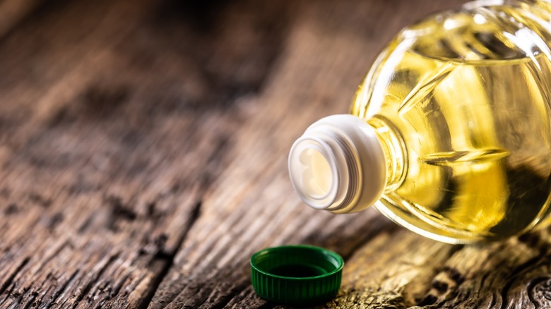 bottle of cooking oil on wood table