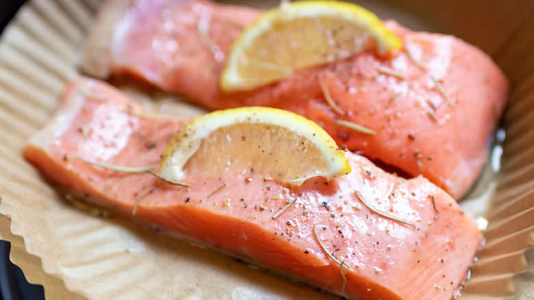 Salmon fillets in an air fryer liner