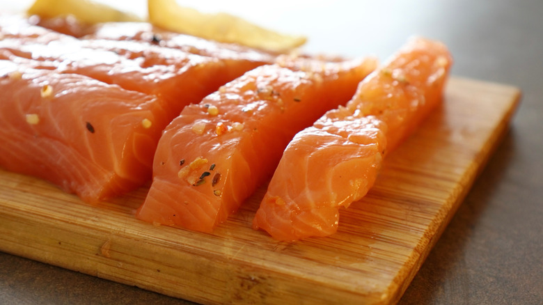 Seasoned salmon on a wooden board