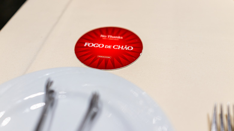 Fogo de Chão red card on dining table