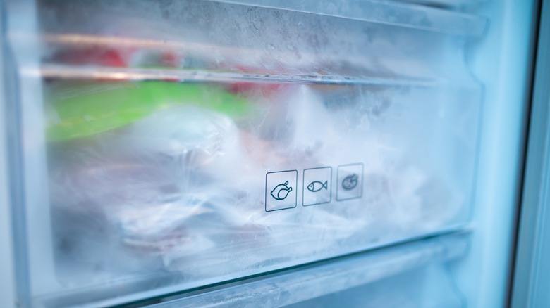 Freezer drawers with chicken, fish, and pizza logos