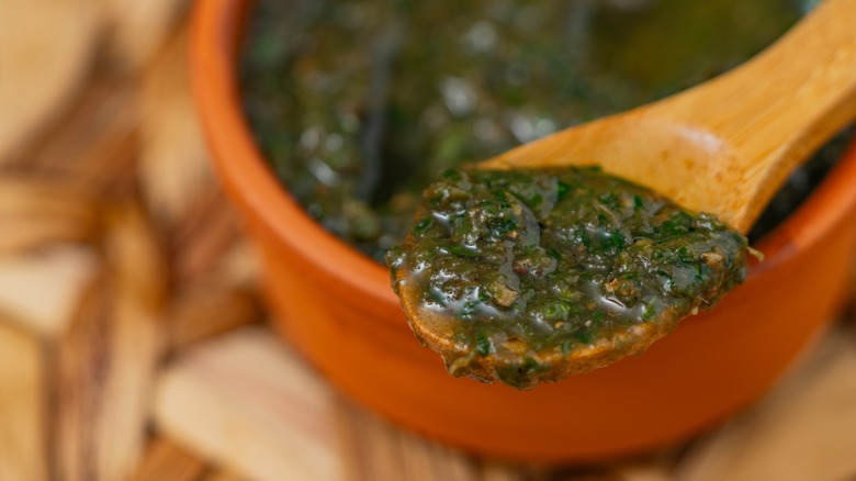Chimichurri on a wooden spoon