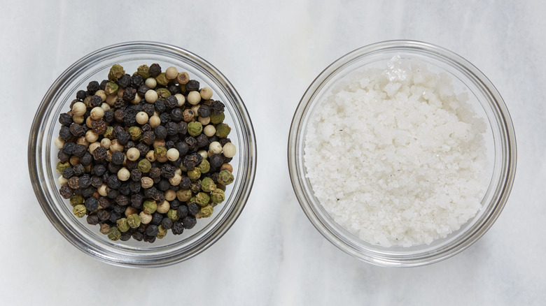 Bowls of salt and peppercorns